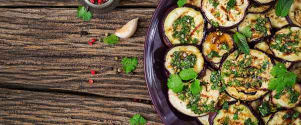 license-eggplant-grilled-with-balsamic-sauce-garlic-cilantro-and-mint-vegan-food-grilled-aubergine-top-view-flat-lay-6732460-600x250-crop.jpg