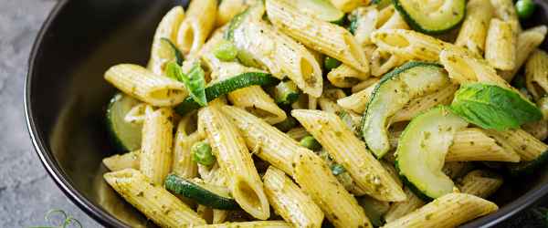 license-penne-pasta-with-pesto-sauce-zucchini-green-peas-and-basil-italian-food-6676680-600x250-crop-50-50.jpg